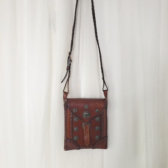 Handcrafted artisan brown leather crossbody bag metal embellishment braid strap